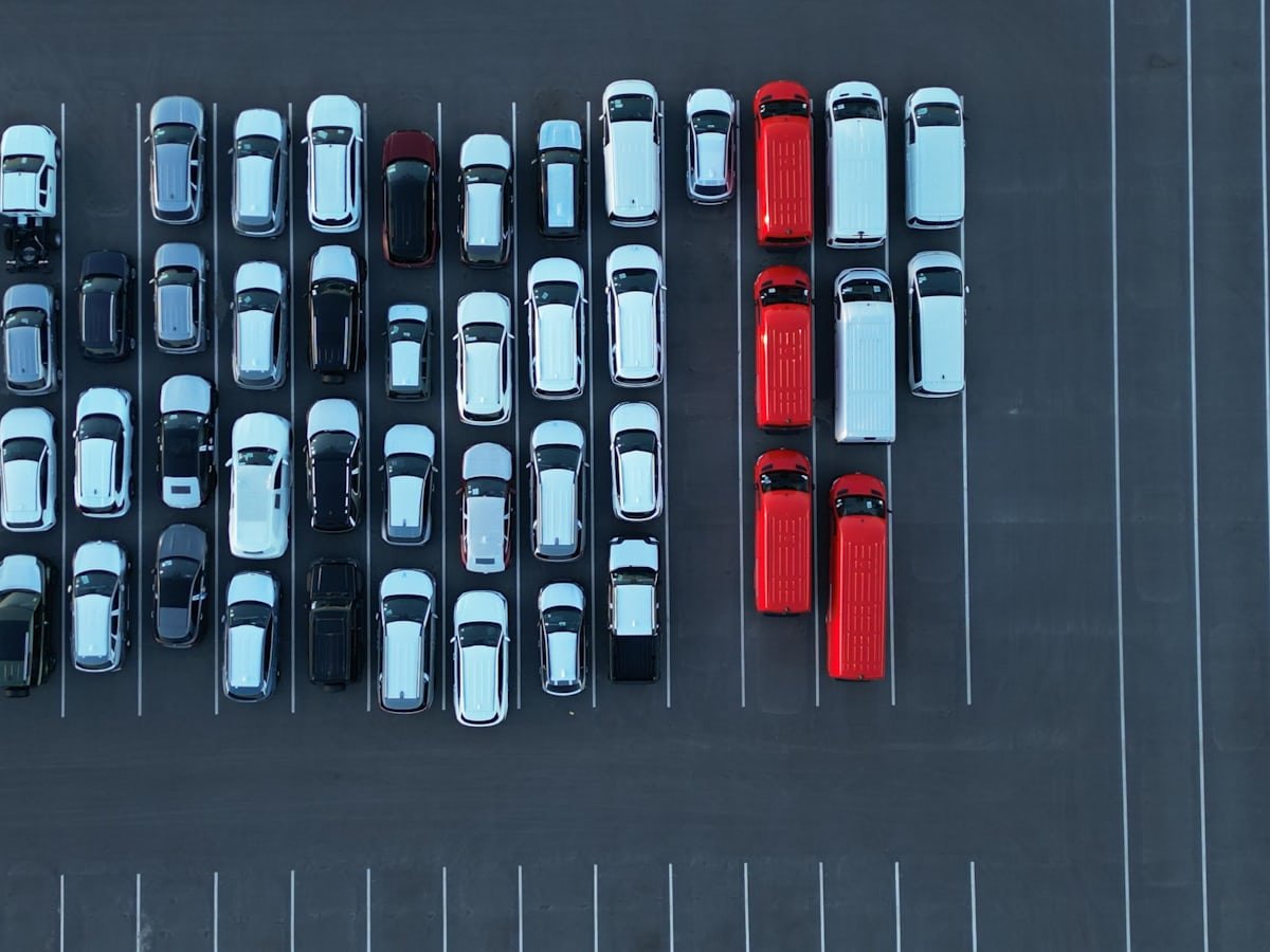 Aerial view of rows of vehicles parked at a U.S. auction yard