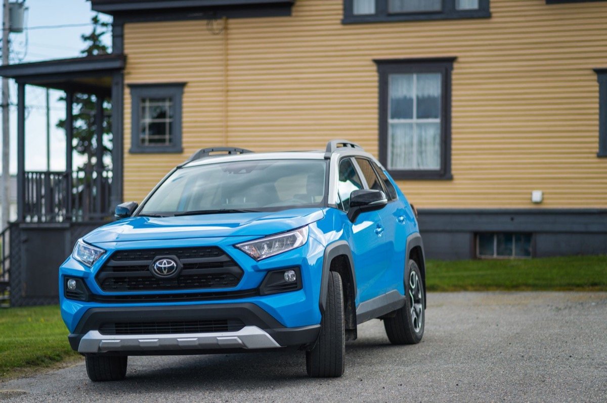 A blue Toyota RAV4, one of the models most requested by Ghanaian buyers, parked in a driveway